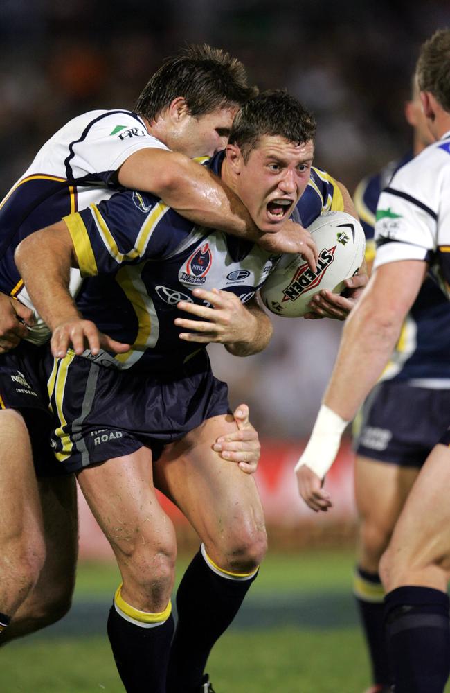 Dane Carlaw tackles Luke O’Donnell as he lines up Darren Lockyer.