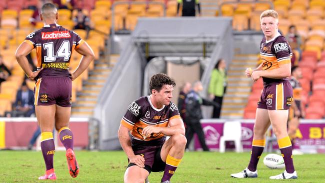 Brodie Croft and his Broncos teammates react after the loss to the Titans. Picture: Bradley Kanaris/Getty Images