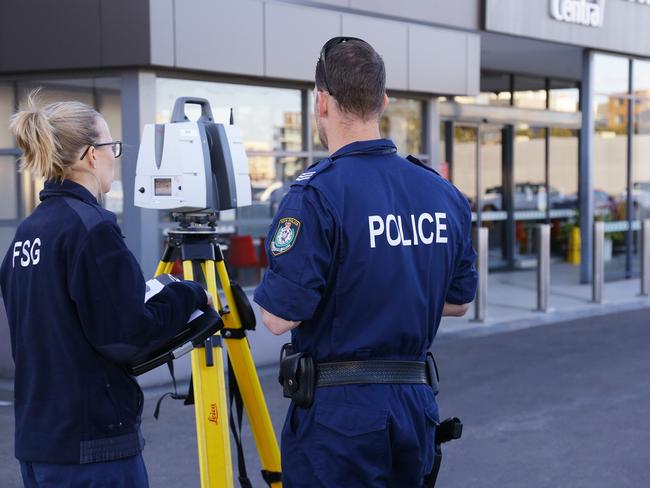 Police conduct laser scan of the scene where Ahmad was gunned down.