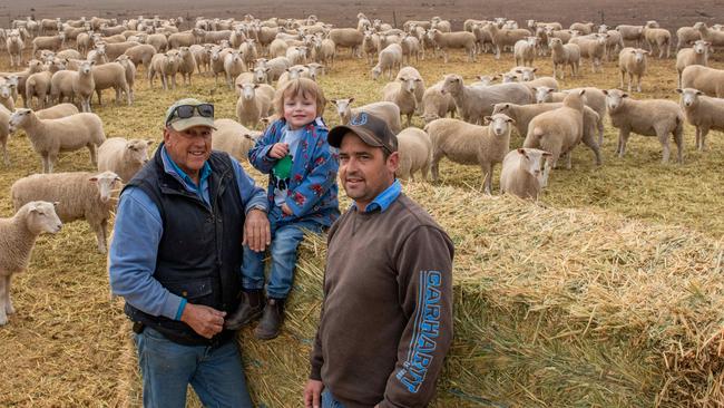 Mr de Fegely, his son Richard and grandson Archer. Their farm’s fodder bill has increased fourfold to $480,000, due to the worst drought seen there since at least 1967. Picture: Ian Wilson