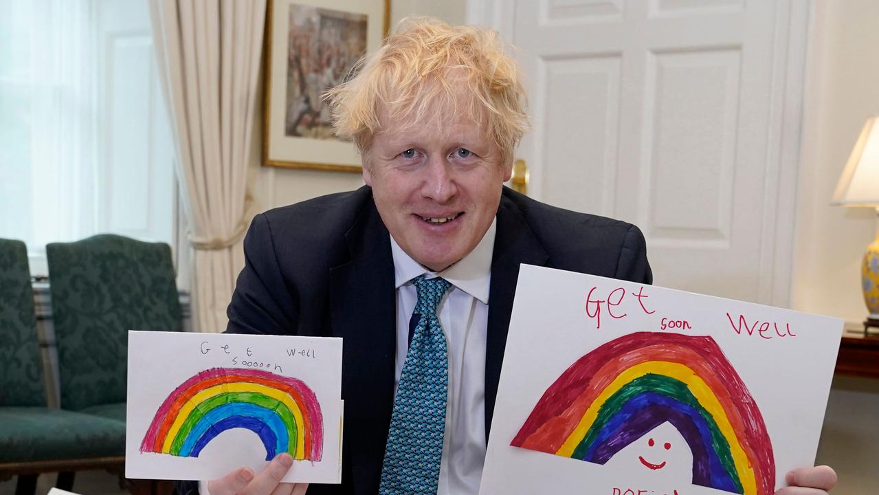 Britain's Prime Minister Boris Johnson with his Get Well Soon cards sent in by children while he was ill with coronavirus. Picture: Andrew Parsons/AFP PHOTO