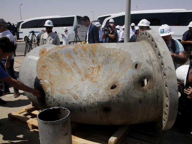 Holes caused by fragments of a missile in a damaged pipe in the Aramco's Khurais oil field, Saudi Arabia. Picture: AP