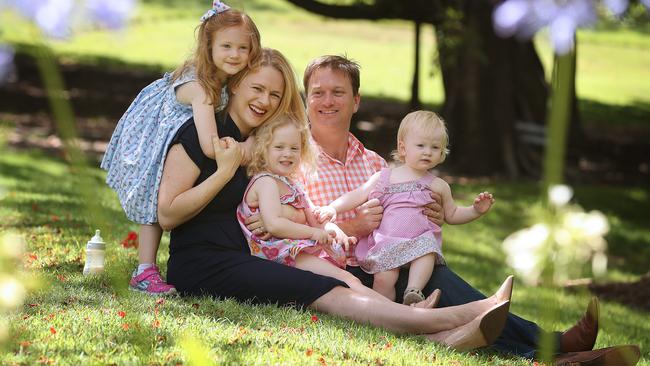 Amanda Stoker with her husband, Adam, and their children Mary, 5, Jane, 3, and Emma, 1, in Brisbane’s Roma Street Parkland. Picture: Lyndon Mechielsen