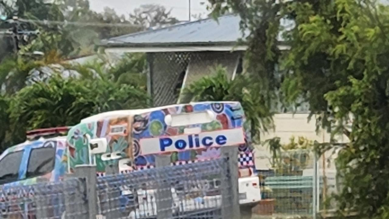 Police speak with the occupants of a house in Kirby Street, Koongal, North Rockhampton, on November 30, 2022.