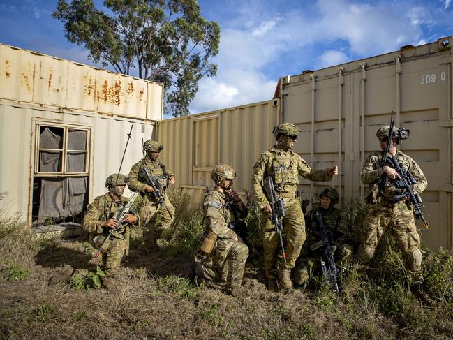 Commanding Officer of 1st Battalion, the Royal Australian Regiment Lieutenant Colonel Brent Hughes works alongside soldiers from United States Army and Japanese Ground Self-Defense Force during an assault at the Urban Operations Training Facility on Exercise Brolga Run, on 24 May 2024, at Townsville Field Training Area, Queensland. Photo: CAPT Brittany Evans