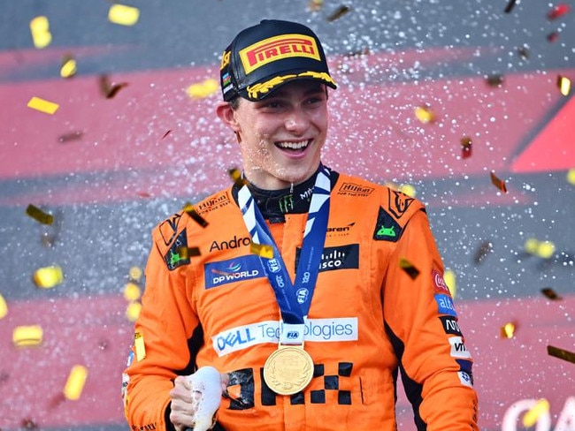 BAKU, AZERBAIJAN - SEPTEMBER 15: Race winner Oscar Piastri of Australia and McLaren celebrates on the podium during the F1 Grand Prix of Azerbaijan at Baku City Circuit on September 15, 2024 in Baku, Azerbaijan. (Photo by Dan Mullan/Getty Images)