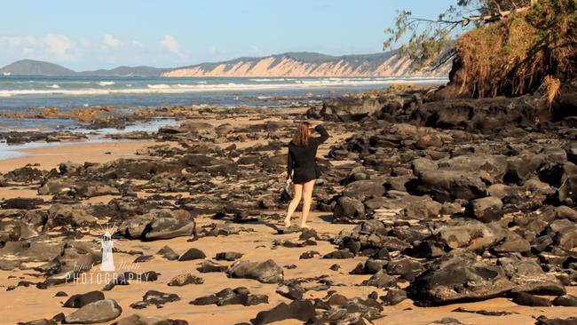 A stunning photo of the exposed rocks at Rainbow Beach taken by John Clough of Infinity Flights Photography and reproduced with their permission.