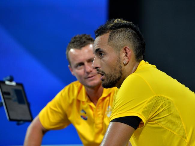 BRISBANE, AUSTRALIA - JANUARY 07: Team Captain Lleyton Hewitt talks tactics with Nick Kyrgios of Australia in the match against Stefanos Tsitsipas of Greece during day five of the ATP Cup Group Stage at Pat Rafter Arena on January 07, 2020 in Brisbane, Australia. (Photo by Bradley Kanaris/Getty Images)