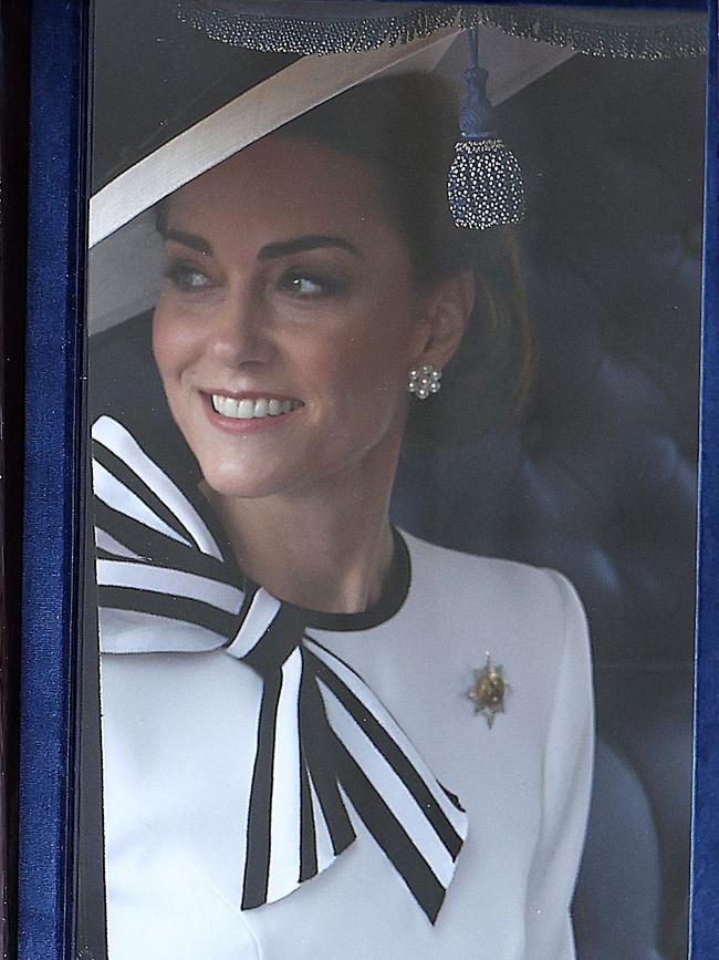 Earlier, onlookers had erupted in cheers as she travelled past in a carriage. Picture: Henry Nicholls/AFP