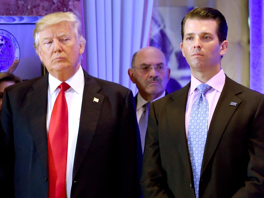 Donald Trump, pictured with son Donald Jr., has called the probe a “political hoax”. Pic: AFP)