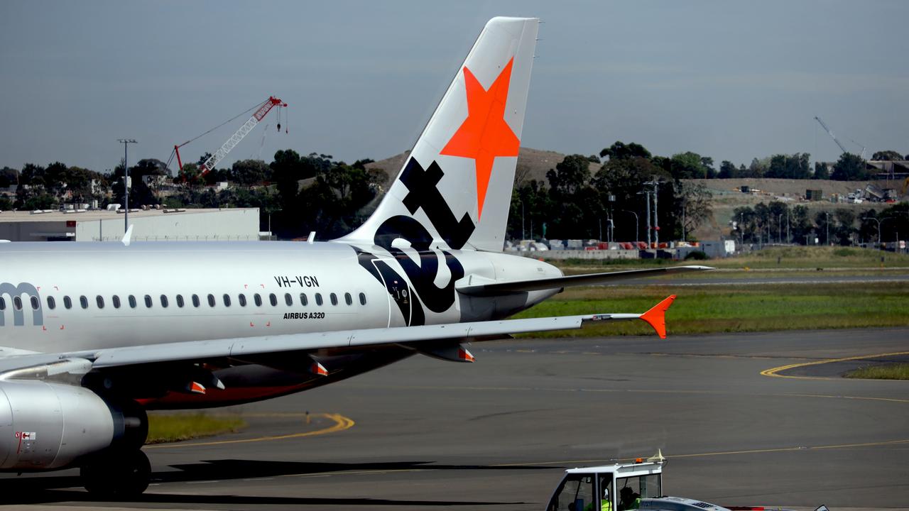 Queensland Ambulance Service attended Cairns Airport after it was reported that several people had become overcome by fumes on a flight. Picture: NewsWire / Nicholas Eagar.