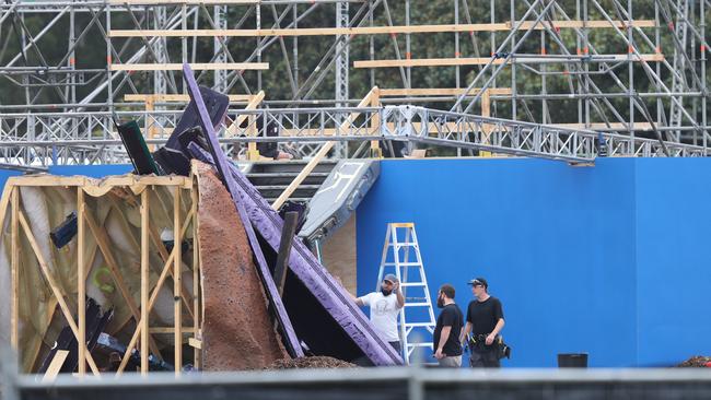 Production crew working on the set at Centennial Park in Sydney. Picture: John Grainger