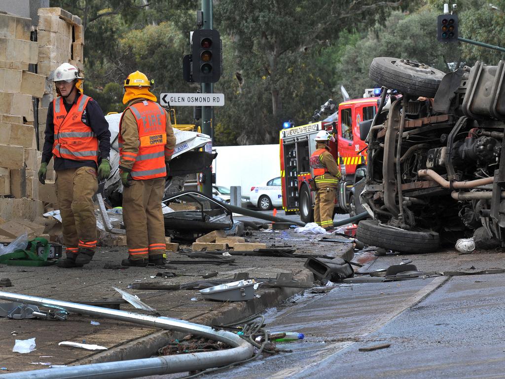 Emergency service workers at the scene of the crash. Picture: Roger Wyman