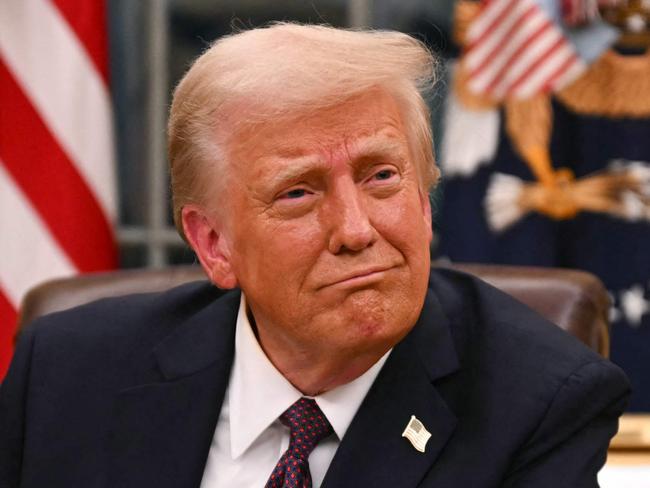 US President Donald Trump signs executive orders in the Oval Office of the White House in Washington, DC, on January 20, 2025. Picture: NewsWire / Jim WATSON / POOL / AFP