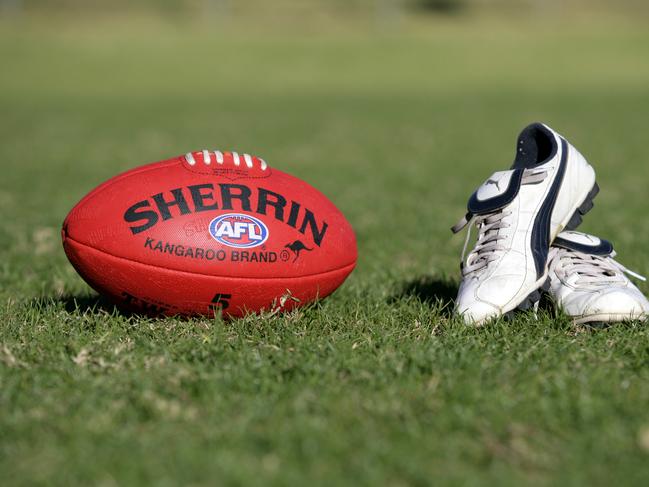 Generic AFL Sherrin football and football boots. sport /