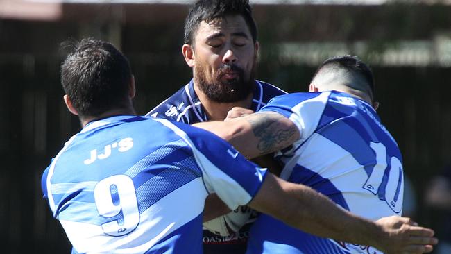 Seahawks players Sam Meskell and Nick Harrold make a tackle against Runaway Bay. Picture: Mike Batterham