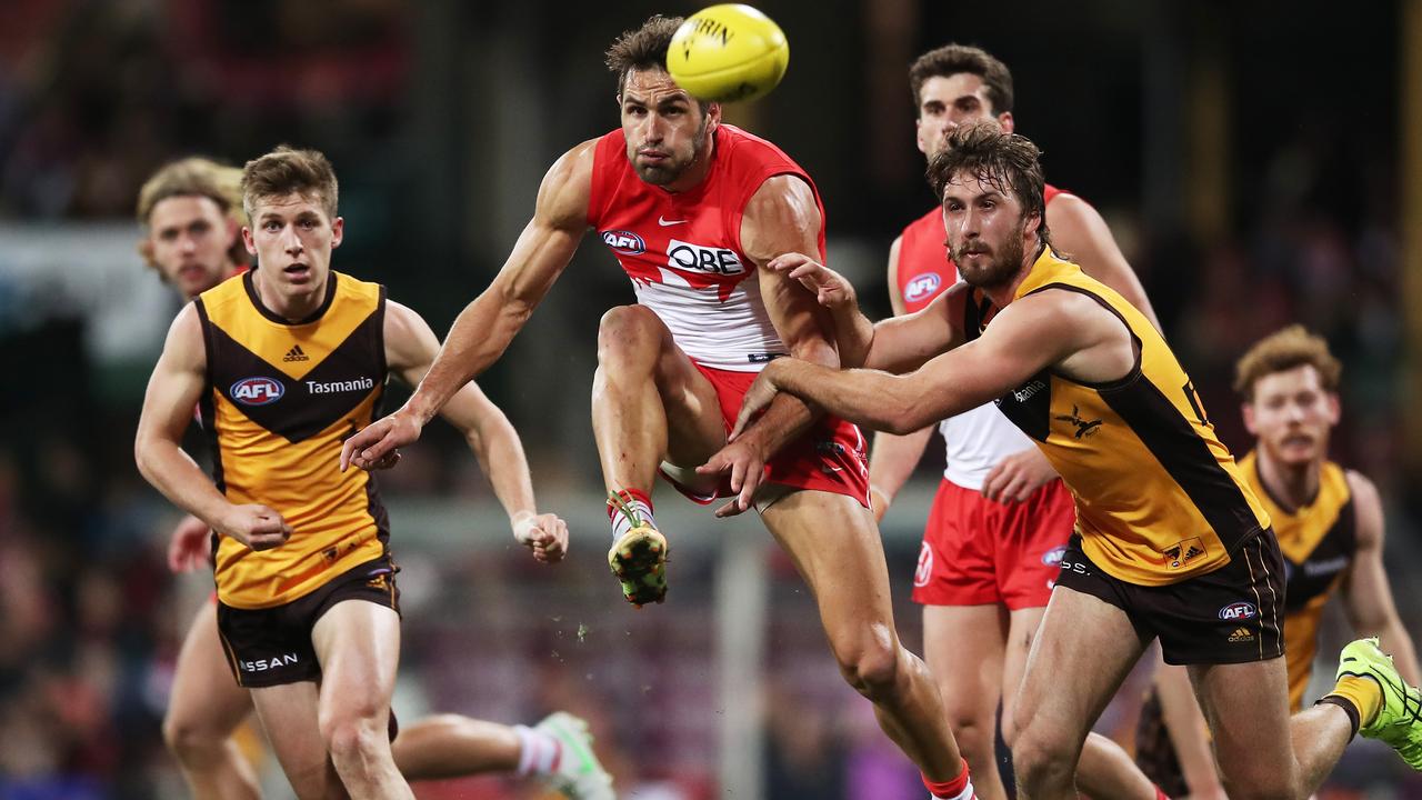 Josh Kennedy drives the Swans forward despite the close attention. Picture: AFL Photos/via Getty Images