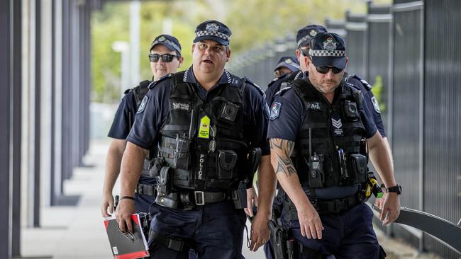 Senior Sergeant Nick Sellars (left) with officers conducting Operation Romeo Luminous at Helensvale today. Picture: Jerad Williams