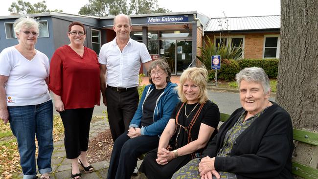 Save Healesville Hospital Action Group members Sheryl Treen, Kersten Gentle, Peter Carruthers, and (seated) Gayle Slater, Jane Judd, and Bev Schmolling outside the hospital. Picture: Steve Tanner.