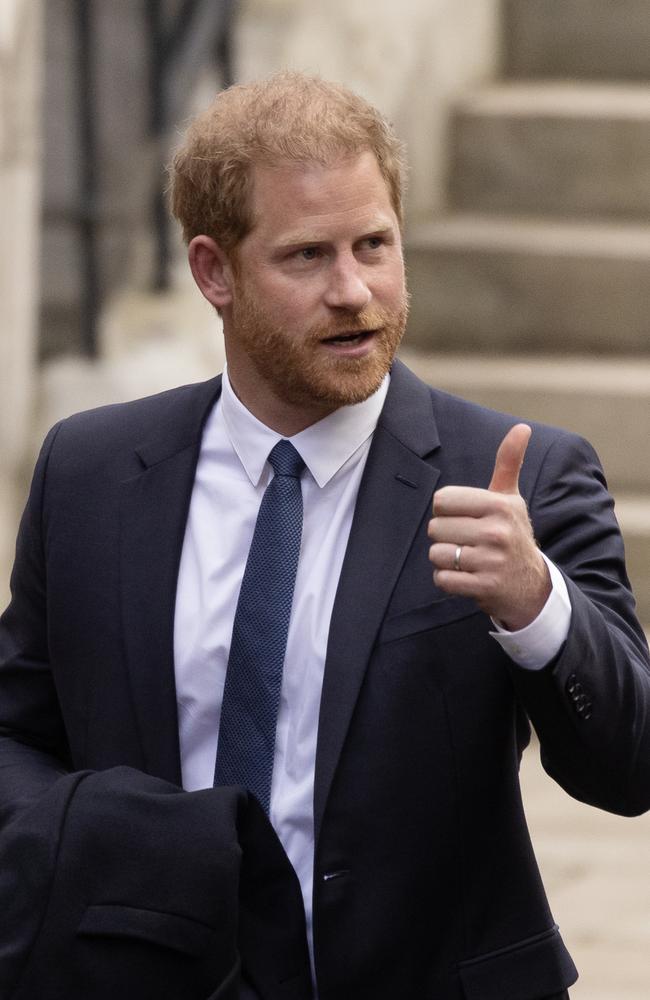 Prince Harry gave the waiting paparazzi and thumbs up. Picture: Dan Kitwood/Getty Images