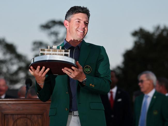 AUGUSTA, GEORGIA - APRIL 13: Rory McIlroy of Northern Ireland poses with the Masters trophy during the Green Jacket Ceremony after winning the 2025 Masters Tournament at Augusta National Golf Club on April 13, 2025 in Augusta, Georgia.   Michael Reaves/Getty Images/AFP (Photo by Michael Reaves / GETTY IMAGES NORTH AMERICA / Getty Images via AFP)