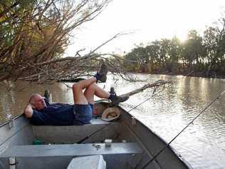 RELAXING RIVER: Paula Hetherington's shot of her husband took out second place in the lifestyle category of the QCWA state photography competition. Picture: Paula Hetherington