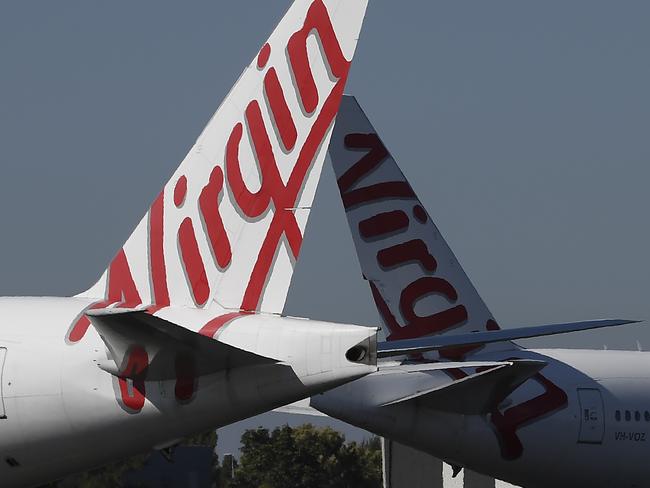 BRISBANE, AUSTRALIA - AUGUST 05: Virgin Australia wide-body aircrafts are seen parked in the Brisbane Airport on August 05, 2020 in Brisbane, Australia. Virgin Australia has announced 3000 job cuts as part of a radical cost reduction strategy for the airline, while its discount provider Tiger Air will close. (Photo by Albert Perez/Getty Images)