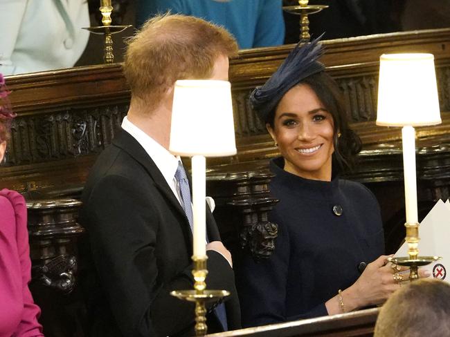 Prince Harry and Meghan, Duchess of Sussex take their seats ahead of the wedding of Princess Eugenie of York and Jack Brooksbank in St Georgeâ€™s Chapel, Windsor Castle, near London, England, Friday Oct. 12, 2018. (Danny Lawson/Pool via AP)