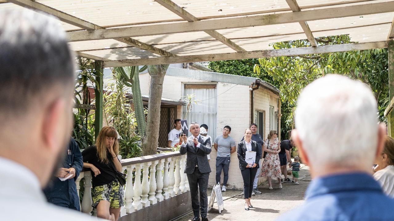 Auctioneer Clarence White brings down the gavel at 10 England Ave, Marrickville.