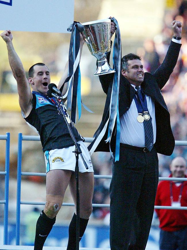 Port Adelaide’s captain Warren Tredrea and coach Mark Williams with the 2004 premiership cup. 