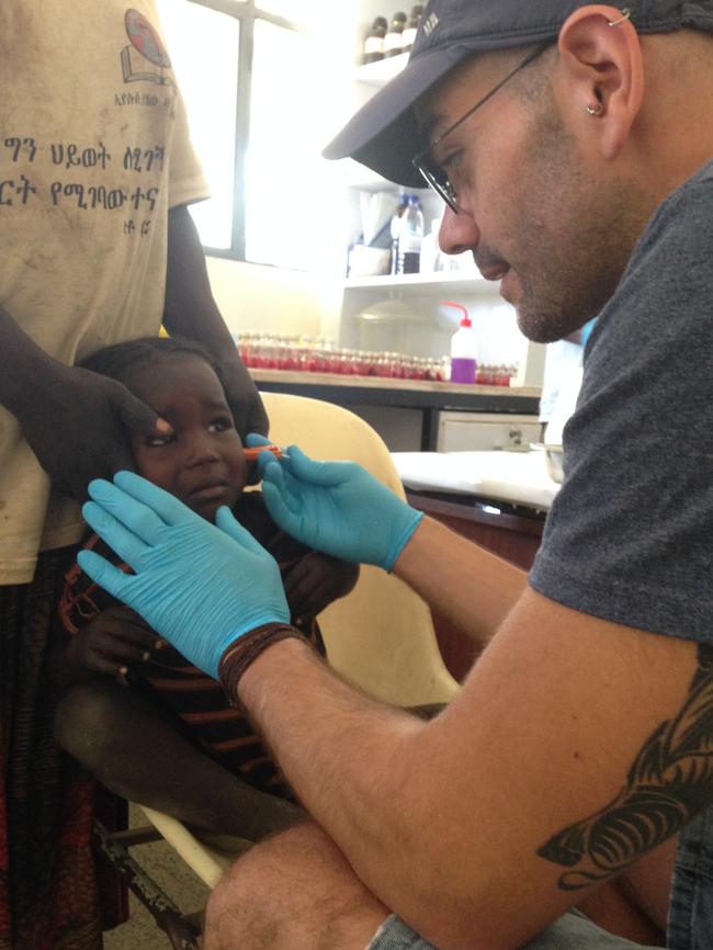 Oscar Kristein with the small needle device in Ethiopia.