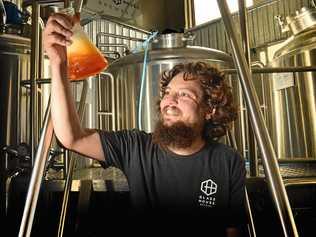 STRANGE BREW: Beer brewer at Glass House Brewery in Forest Glen Brendan Chan checks the coconut and cocoa brew for the upcoming Great Australasian Beer Spectacular. Picture: John McCutcheon