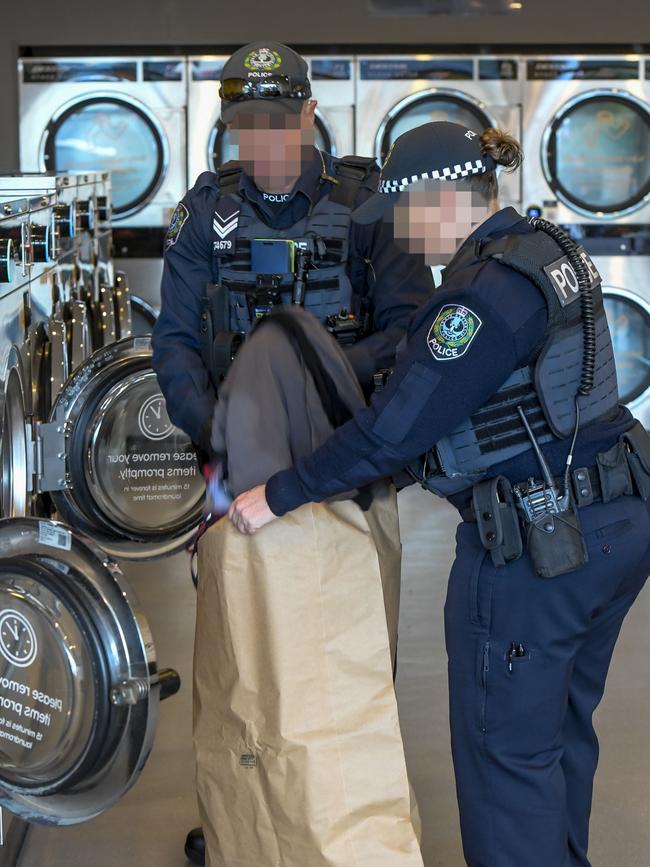 Police at the scene at Minicozzi shopping centre Payneham road. Picture: Roy VanDerVegt
