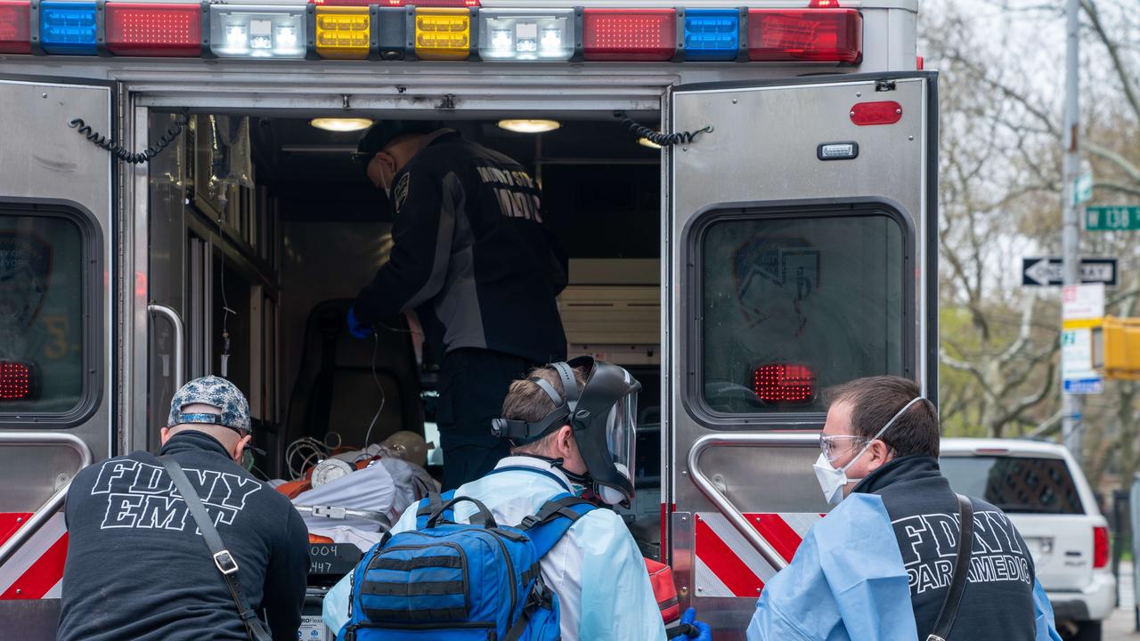 Medical staff attend to an elderly person experiencing difficulty breathing. Picture: David Dee Delgado/Getty Images/AFP