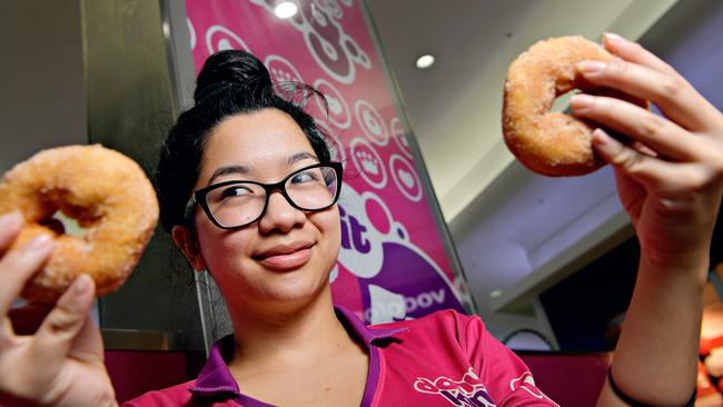 Fiona Sang prepares one of the last batches of cinnamon donuts as the store prepared to close its doors at Casuarina Square.