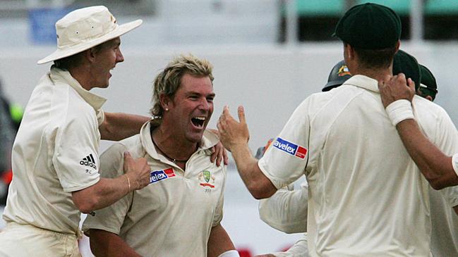 Shane Warne celebrates a wicket with teammates. Picture: AFP Pictures