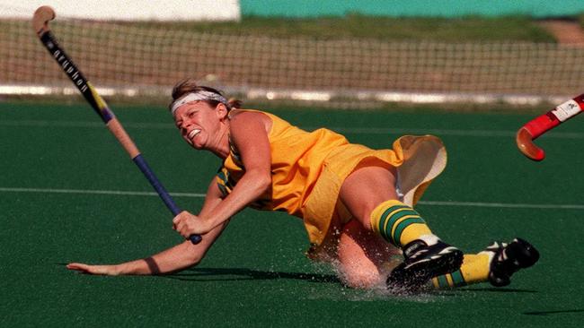 Danielle Roche takes a tumble while shooting for goal for Australia in 1996 Olympics action in Atlanta.