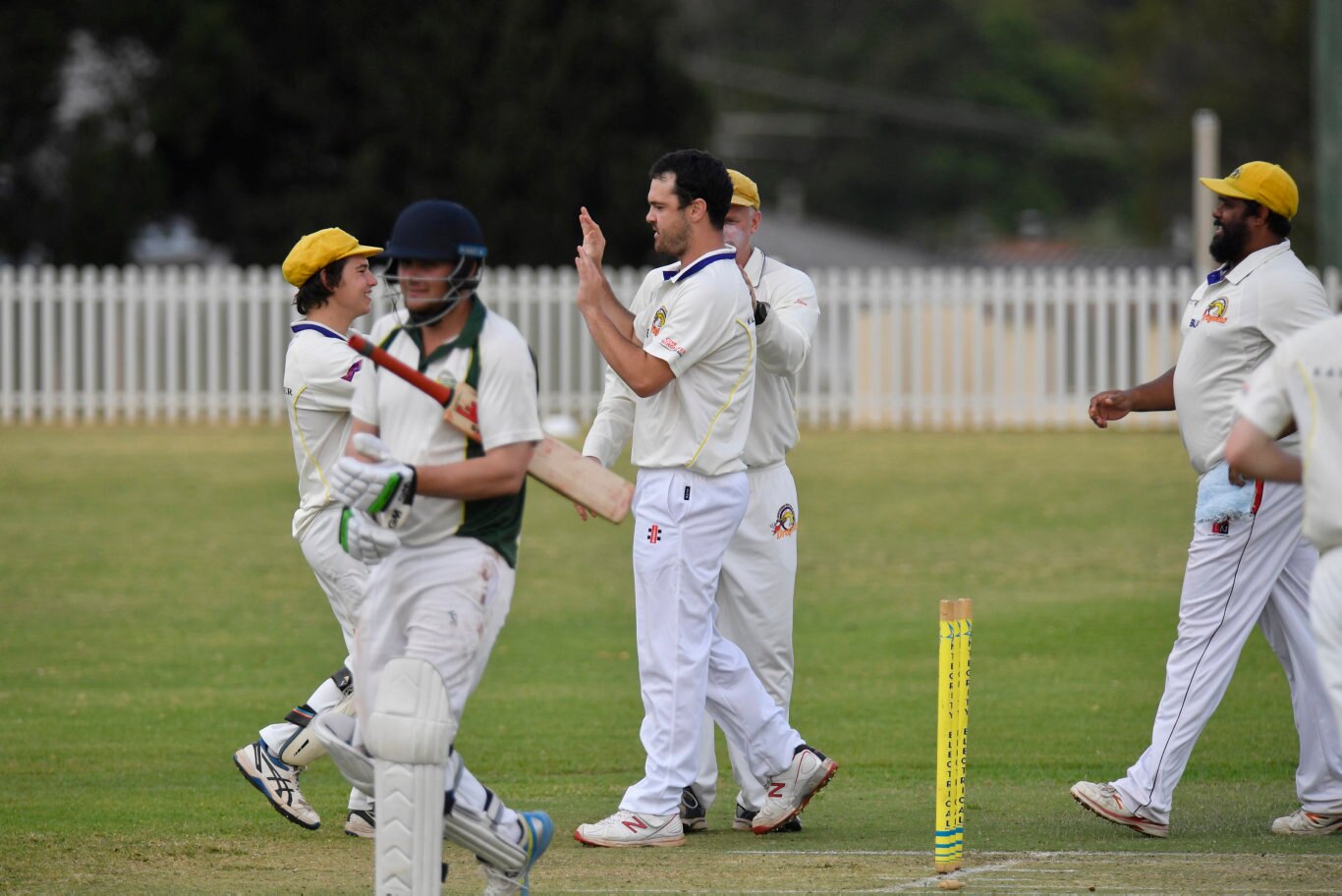 Northern Brothers Diggers players Jace Hudson (centre) and Cody Walker celebrate after Jace Hudson bowled Mitch Teske of Lockyer Lightning out in round five Harding-Madsen Shield cricket at Rockville Oval, Saturday, October 19, 2019. Picture: Kevin Farmer