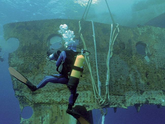 This 1998 image provided by RMS Titanic, Inc., shows a 17-ton portion of the hull of the RMS Titanic as it is lifted to the surface during an expedition to the site of the tradegy. The piece along with 5,000 other artifacts will be auctioned as a single collection on April 11, 2012 100 years after the sinking of the ship. (AP Photo/RMS Titanic, Inc.)