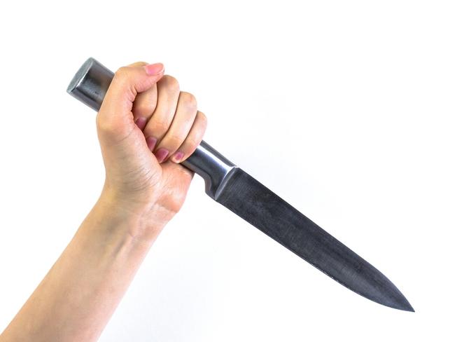 Woman hold kitchen knife generic.