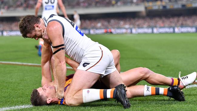 Dayne Zorko and Heath Shaw battle it out. Picture: AAP Image/Darren England