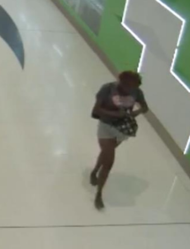 Police have released images from CCTV footage of a woman who may be able to assist police with their inquiries into stealing and fraud offences on August 13. Picture: QPS