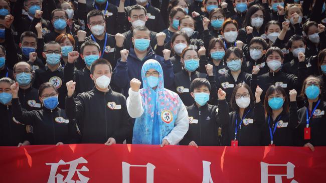 A medical assistance team at a ceremony marking their departure after helping with the COVID-19 coronavirus recovery effort, in Wuhan. Picture: STR/AFP