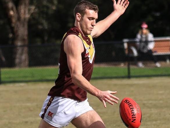 Ryan White gets a kick away for Boronia in the Eastern Football League (EFL). Picture: Davis Harrigan