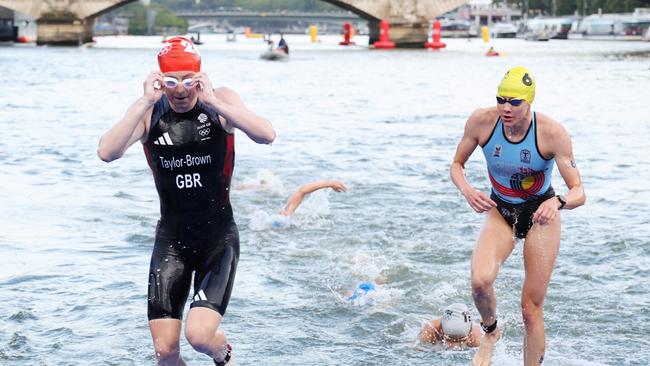 Jolien Vermeylen (R) of Team Belgium emerges from the Seine during the Women's Individual Triathlon. (Photo by Ezra Shaw/Getty Images)