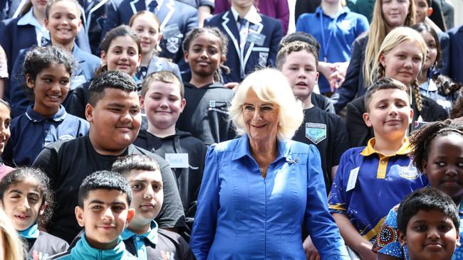 Queen Camilla (C) poses for a group photo with students, authors and representatives from the NSW Government during a visit to the Green Square Library on October 22 in Sydney. Picture: David Gray-Pool/Getty Images