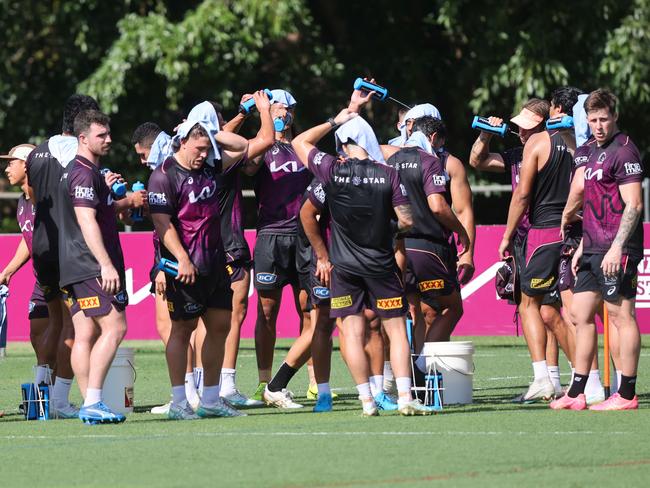 Broncos players seeking a desperate cool-down. Picture: Nigel Hallett