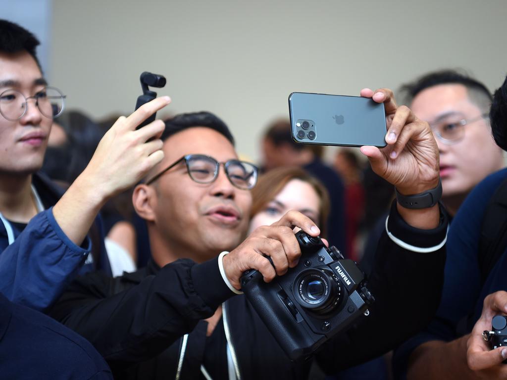 A man tries out a new Apple iPhone 11 Pro. Picture: AFP