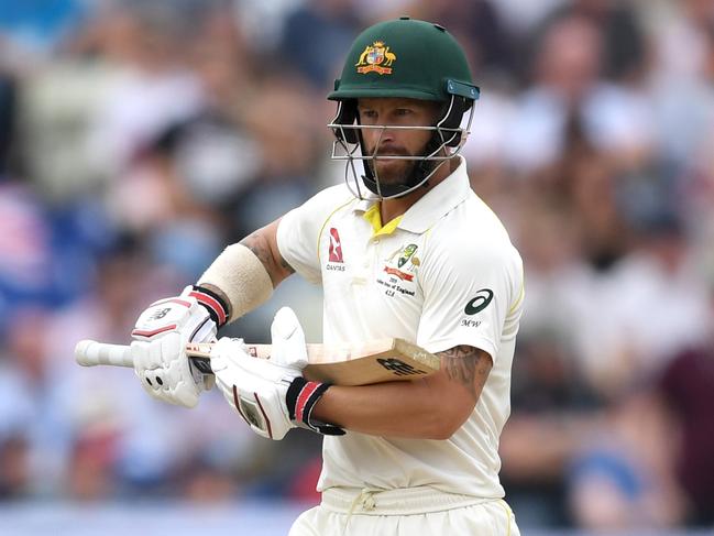 Matthew Wade cradles his bat after reaching his half century. Picture: GARETH COPLEY/GETTY