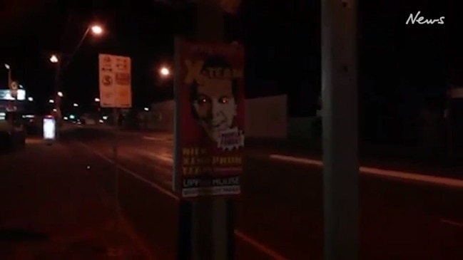 Nick Xenophon poster with flashing red eyes.